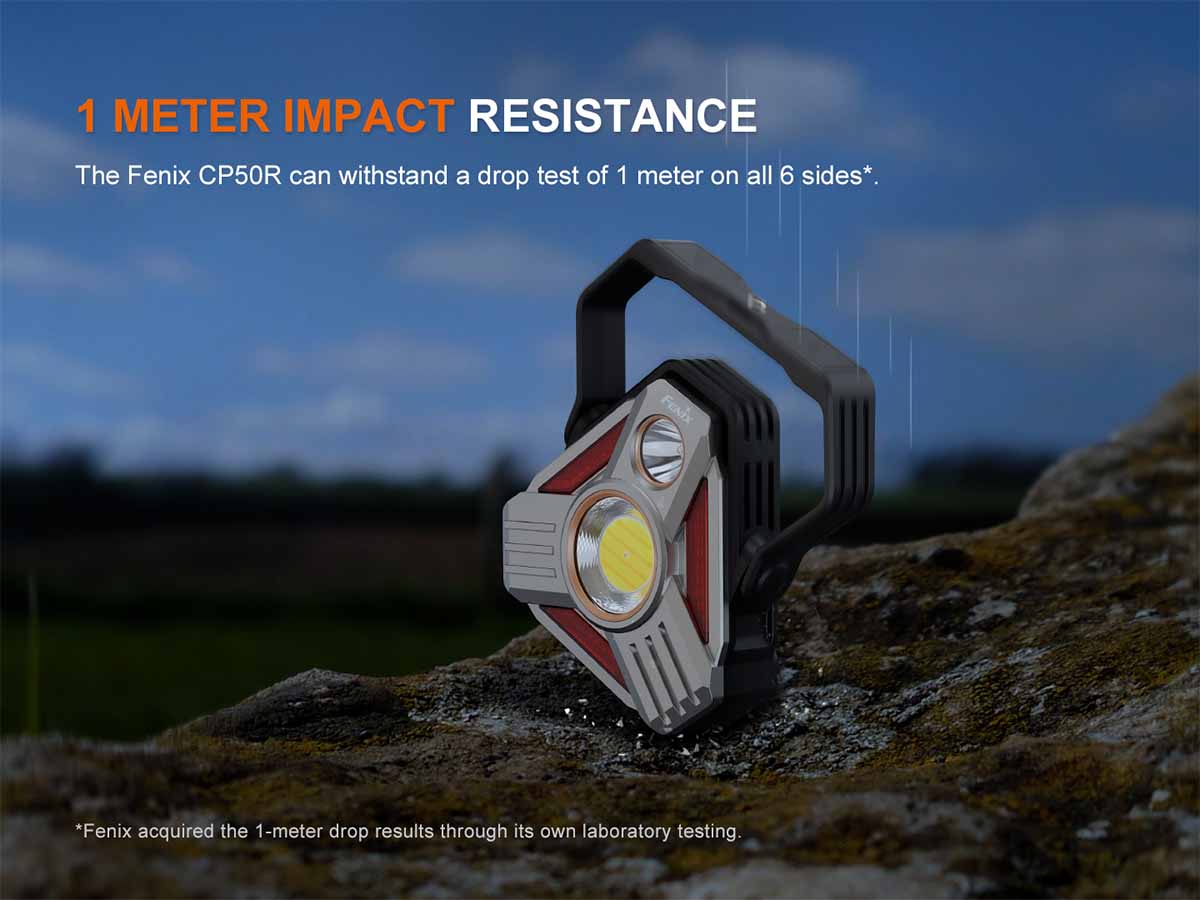 Fenix CP50R lantern on a rock with impact resistance text
