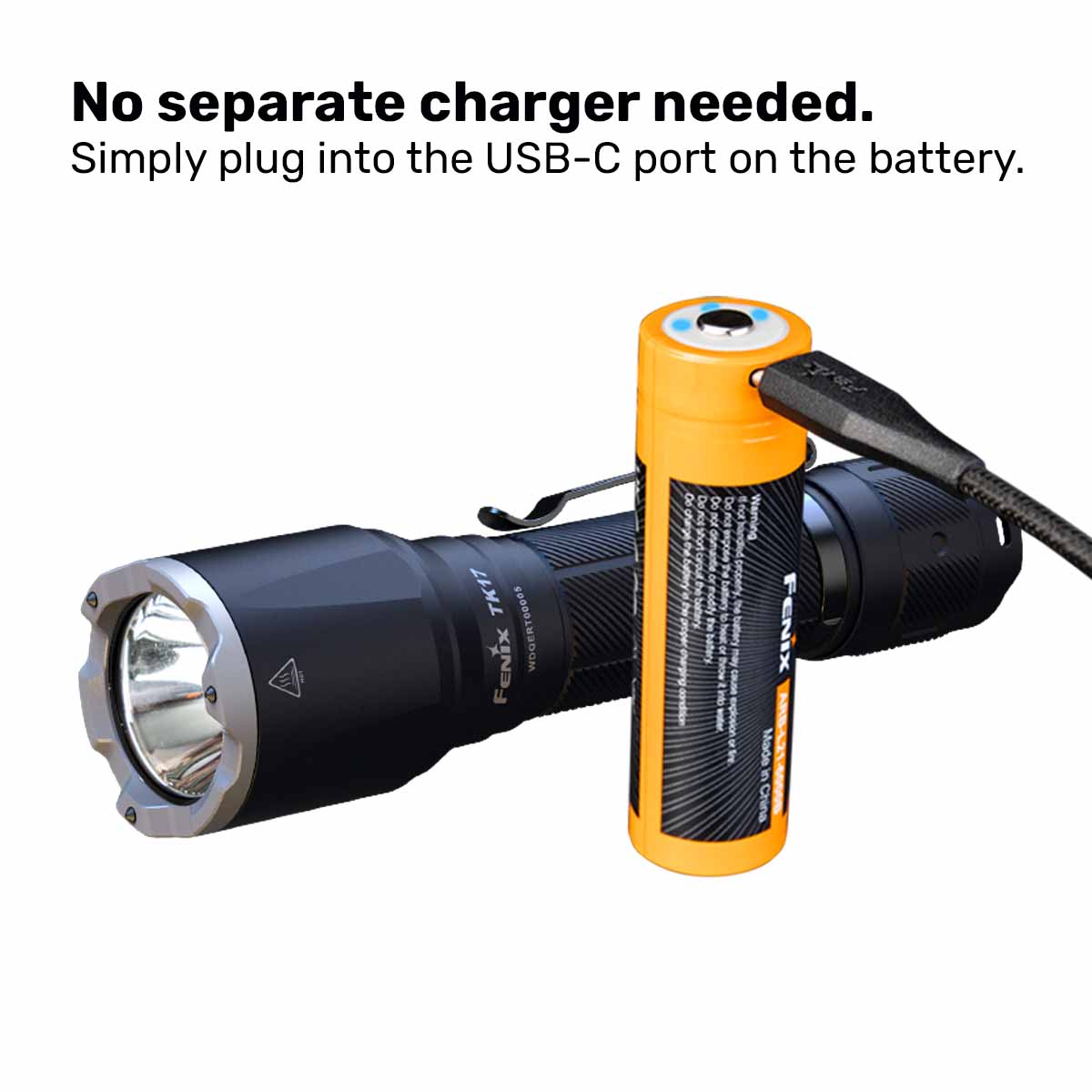 Fenix TK17 flashlight with battery being charged with a USB-C cable on a white background